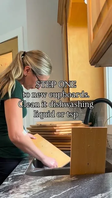 Cleaning cupboard doors before painting, captioned “Step one”