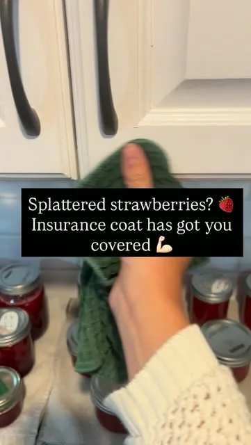 Wiping a painted cupboard, captioned “Splattered strawberries? Insurance coat has got you covered”